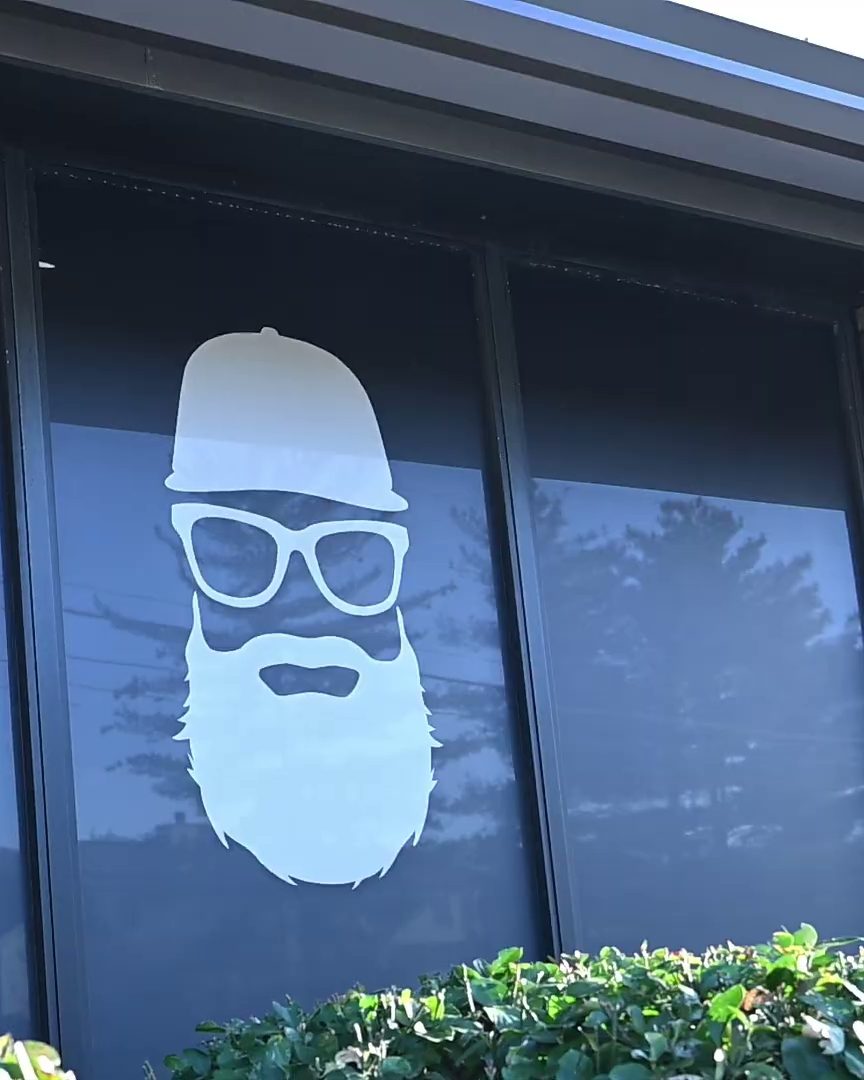 The beard logo on the studio’s front window in Brentwood